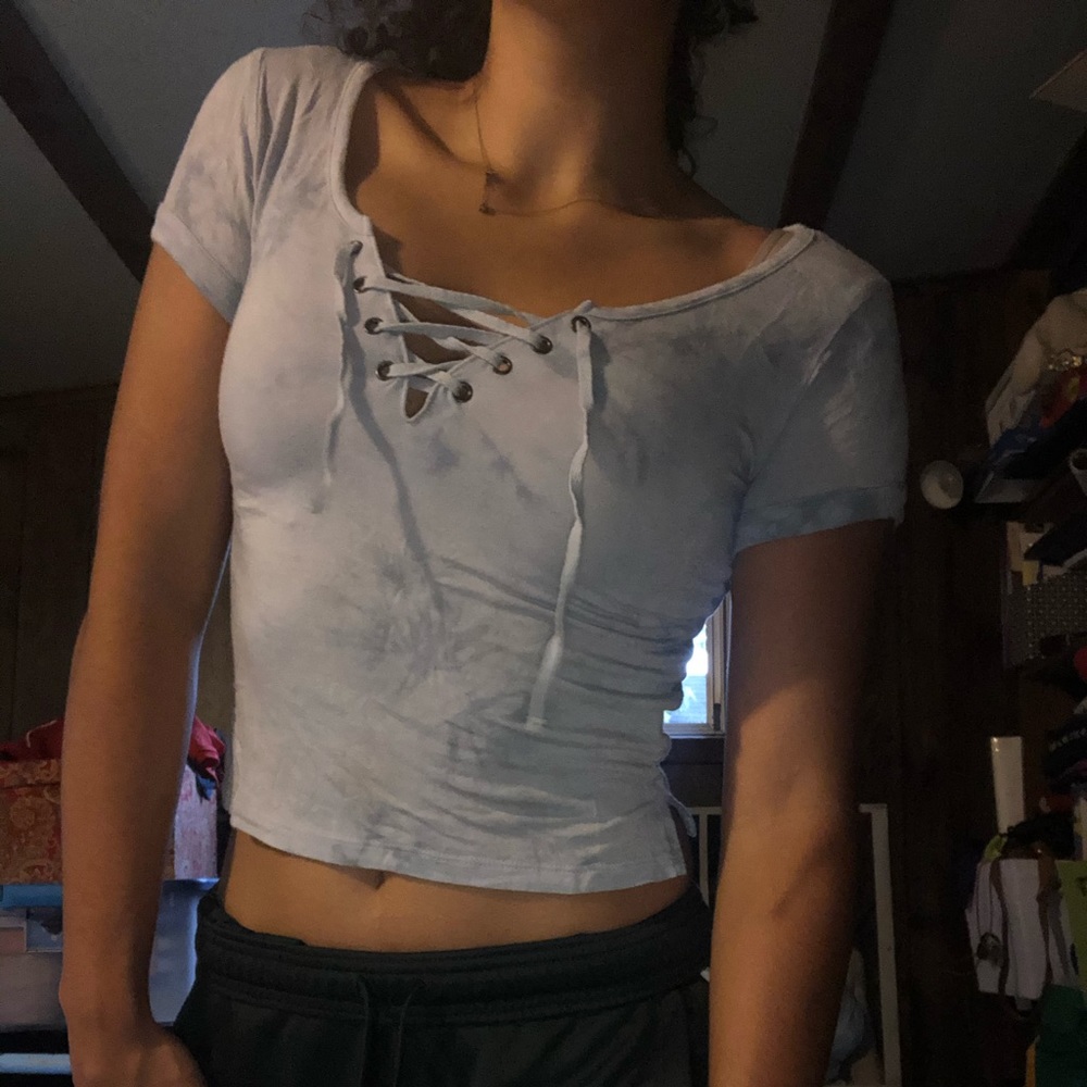 Light blue shirt with cross cross